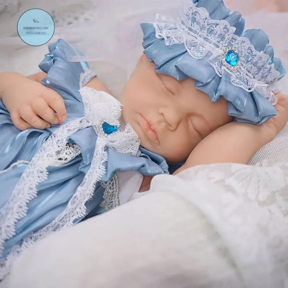 SLEEPING Lifelike girl reborn baby doll in pink dress with realistic face and hair