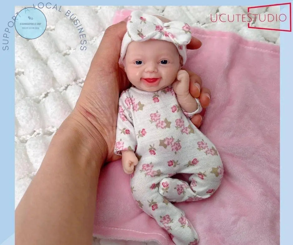 7-Inch Reborn Baby Doll – Handcrafted Silicone Platinum Girl with Realistic Full-Body Design smile, cute and clever girl doll rebornbabydolls.shop