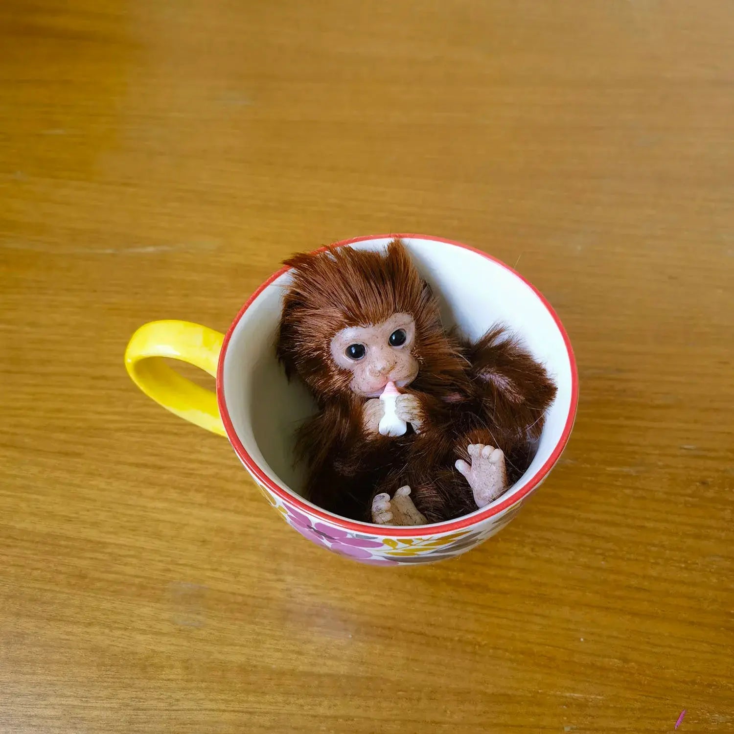 Image of Reborn Baby Dolls 6’’ Avani Doll Full Body Silicone Monkey Drinking