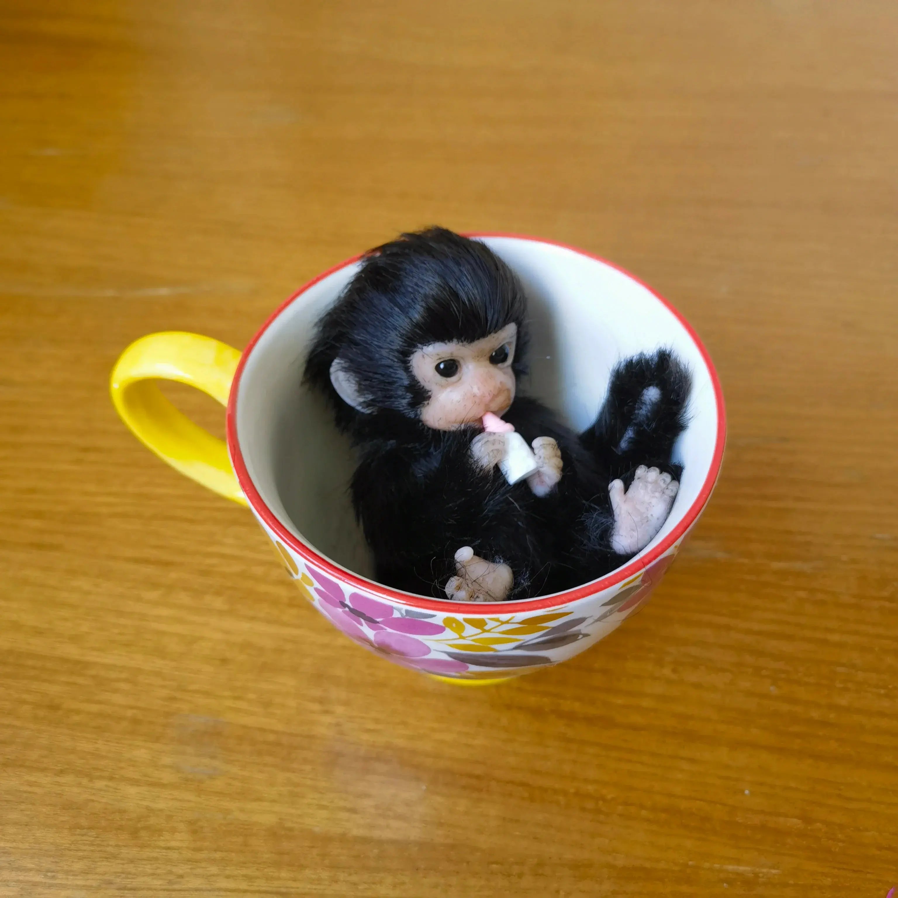 Image of Reborn Baby Dolls 6’’ Avani Doll Full Body Silicone Monkey Drinking