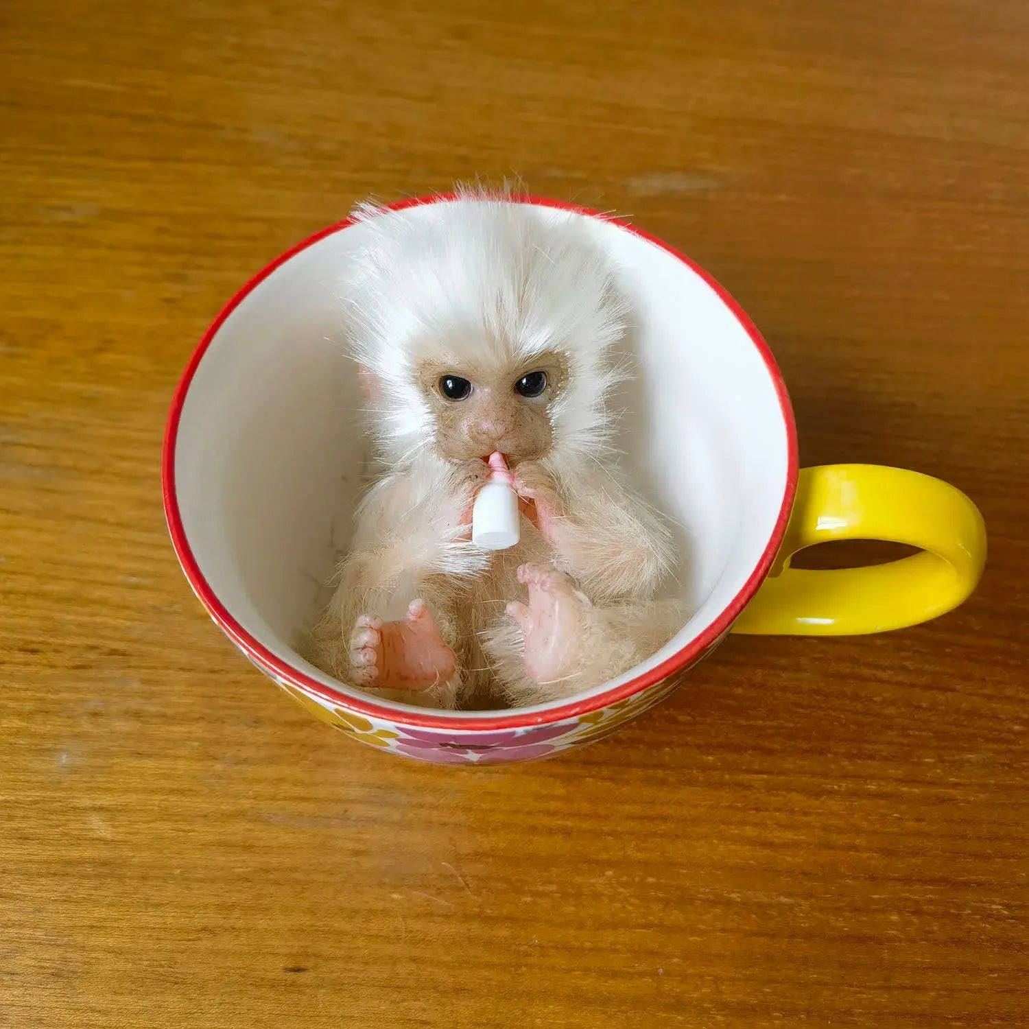 Image of Reborn Baby Dolls 6’’ Avani Doll Full Body Silicone Monkey Drinking