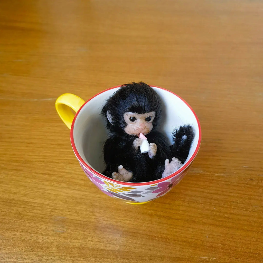 Image of Reborn Baby Dolls 6’’ Avani Doll Full Body Silicone Monkey Drinking