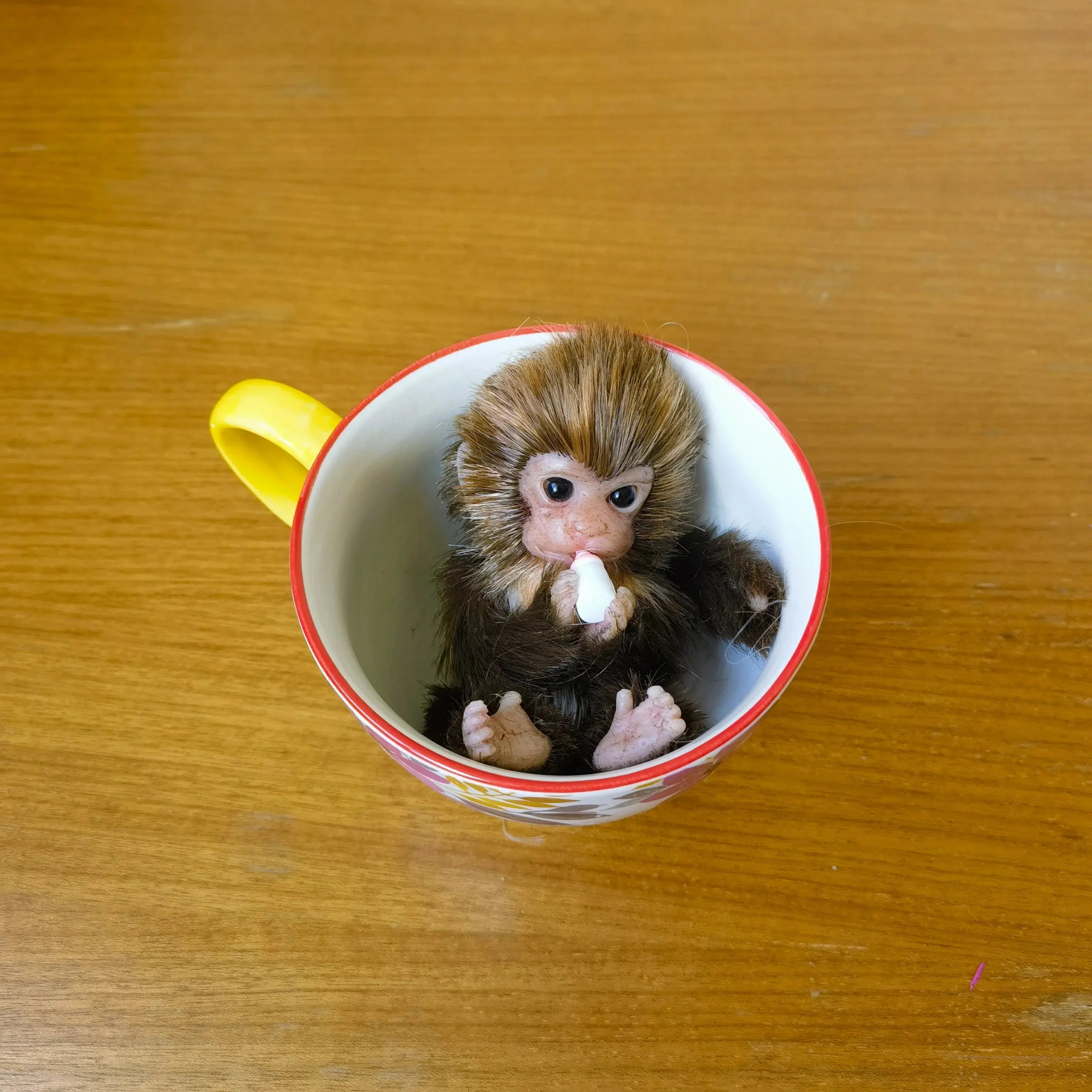 Image of Reborn Baby Dolls 6’’ Avani Doll Full Body Silicone Monkey Drinking